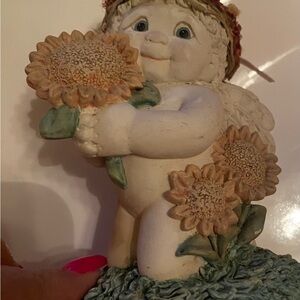 Adorable Cherub Sculpture with Sunflowers
